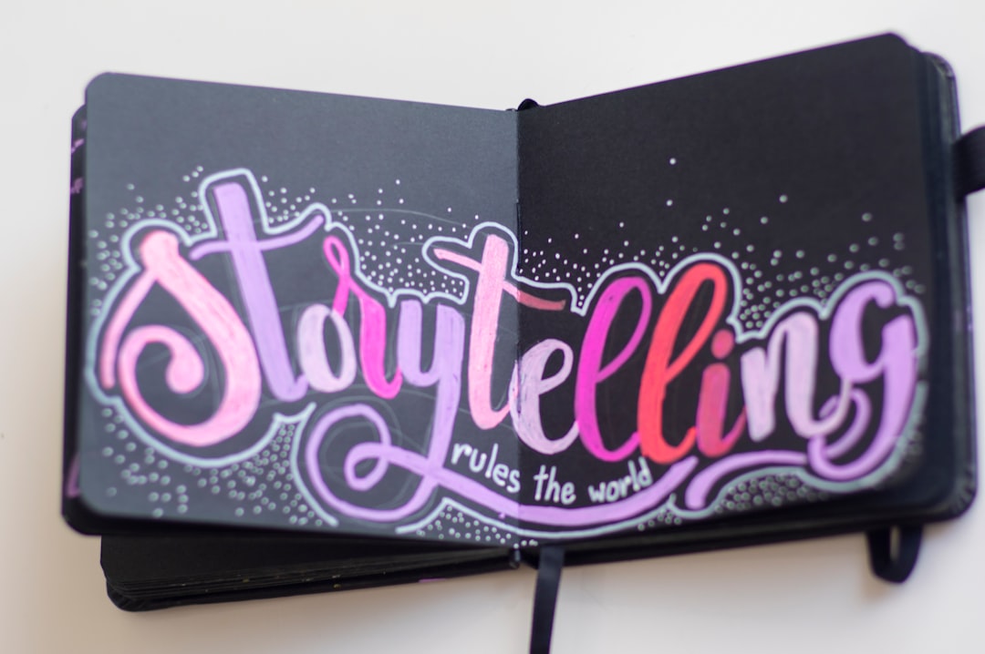 a-black-rectangular-object-with-pink-text-xwb0cnyx7ku